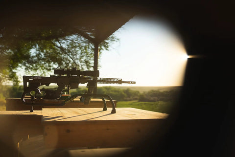Stinger Adjustable Ambidextrous Rifle Shooting Rest With Lightweight Build For Rock Solid Stability Outdoors And Range No Wobble Elevation System Cam Over Front Rest Locks Steel Tube Frame on wooden table