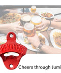 Red Cast Iron Wall Mounted Bottle Cap Opener Set With Open Here Embossed, showcase, on table with drinks and food.