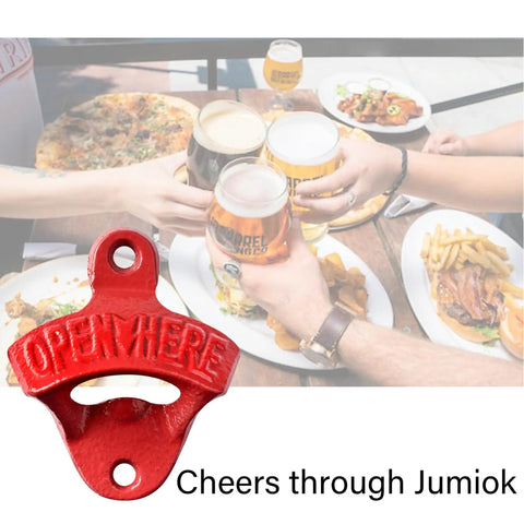 Red Cast Iron Wall Mounted Bottle Cap Opener Set With Open Here Embossed, showcase, on table with drinks and food.