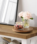 9 Inch Acacia Wood Lazy Susan Turntable Organizer on table with flowers and jar in living room setup