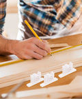 Installation of Double Roller Ball Catch Cabinet Door Latch With Spring Loaded Mechanism on wooden board, three latches in focus