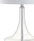 Close-up of teardrop glass table lamp with clear and chrome finish, featuring a white linen drum shade for sleek modern decor
