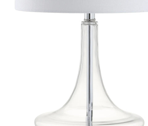 Close-up of teardrop glass table lamp with clear and chrome finish, featuring a white linen drum shade for sleek modern decor
