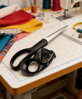 Laser Guided Scissors Pro Grade For Fabric And Paper With Ergonomic Handle on sewing table in craft room