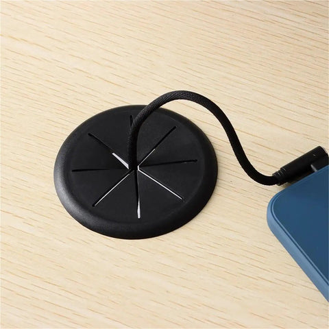 20 Pack Heavy Duty Desk Cable Grommets Kit For Cord Hole Covers With Flexible Rubber Inner Rings To Keep Wires Neat And Secure At Workstations. Black rubber desk cable grommet with cable inserted in a wood tabletop hole.