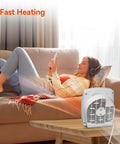 Portable 1500W Space Heater With Adjustable Thermostat And Overheat Protection on a table near a woman on a couch