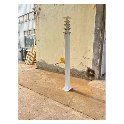 Heavy Duty Self Standing Hand Crank Lifting Mast With Slick Telescopic Design Adjustable Height Portable Work Platform For Construction Maintenance Zero Sweat Operation And Built Tough in a construction site.