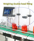 Plug And Play Automatic Two Nozzle Liquid Filler With Digital Screen Precision Weighing Tech for Juice Wine Bottling, showing dual nozzles filling jars.