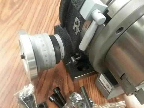 12 Inch Precision Rotary Table Featuring Killer Accuracy 10 Inch 3 Jaw Chuck Reversible Jaws Index Plates Smooth Operation Shop Ready, close-up of adjustment dial.