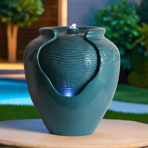 Teal Glazed Pot Water Fountain With Built In Led Light And Pump For Outdoor And Indoor Use on a patio
