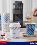 Two Color Leaf Design 10 Oz Disposable Coffee Cups With Lids Sleeves And Stirrers 100 Pack Value Set For Home Office Cafe