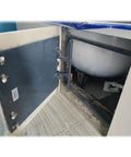 Heavy Duty Steel Drywall Access Panel With Cement Board Core Push To Pop Inspection Door showing open access to plumbing under cabinet.