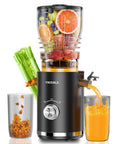 Juicer VMIXBLE, black with clear top hopper; celery and fruit visible, juice flows into a glass.