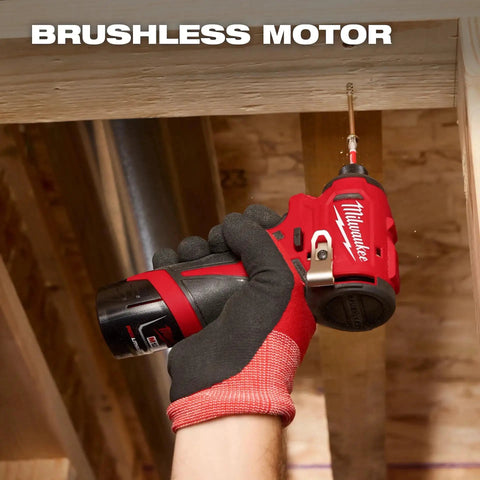 Hand holding 12V Subcompact Brushless Impact Driver Bare Tool With Quarter Inch Hex For Tight Spaces under wooden beam.