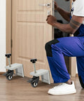 Heavy Hitter Door Dolly Cart 2 Pack 1000 Lb Capacity Steel Frame With 360 Swivel Brakes For Easy Panel Moves, showing rolling support under a door.