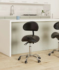 Saddle Stool On Wheels With Backrest Rolling Height Adjustable Ergonomic Saddle Chair in a modern kitchen setting