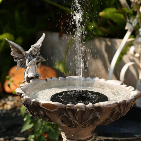 Sun Powered Bird Bath Fountain Pump With Four Nozzles And A 1.4W Solar Panel Kit Submersible Water Pump in stone basin