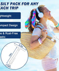 Woman carrying beach umbrella sand anchor heavy duty outdoor stand base with five spiral screws and 2 pack umbrella hooks