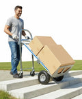 Beefy 3 In 1 Utility Dolly Cart With 550 Lb Capacity Heavy Duty Aluminum Frame Industrial Grade Convertible Cart For Moving Appliances Furniture And Luggage In One Handy Tool, man using stair mode with boxes