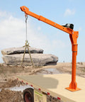Heavy Duty 1100 Lb Truck Bed Crane Hoist With Electric Winch lifting heavy rocks with precision angle control.