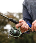 Spartacus II Spinning Fishing Rod And Reel Combo, 7 Foot Medium Heavy Action in use, featuring 3000 Size Reel and KastFlex IM6 Graphite Blank.