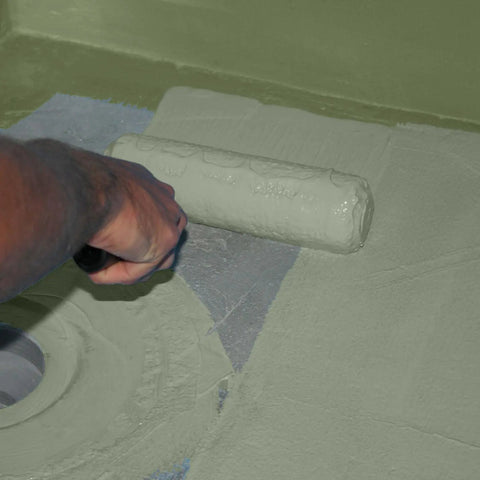 Hassle Free Liquid Waterproofing And Crack Isolation Membrane Straight Up Heavy Duty Anti Fracture Coating For Showers Fast Dry One Gallon Pail being applied with a roller.