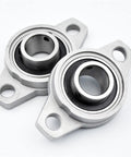 Total Beast Two Piece Zinc Alloy Pillow Block Bearings With Solid Chrome Steel Inserts That Rock Smooth And Quiet On Your Machinery Shafts Without No Wobble Plus Tough Load Capacity And Self Alignment Features You Can Trust For Heavy Duty Work. 17mm silver two-bolt pillow block bearings with chrome steel inserts