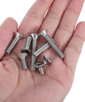 Hand holding bolts from 260 Piece M5 Nut Bolt And Washer Assortment Kit With Carbon Steel Spring Lock Washers.