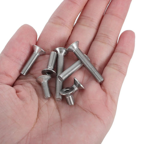 Hand holding bolts from 260 Piece M5 Nut Bolt And Washer Assortment Kit With Carbon Steel Spring Lock Washers.