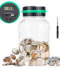 Digital Counting Piggy Bank With LCD Display For Adults 1.8L Transparent Coin Jar filled with coins on white background