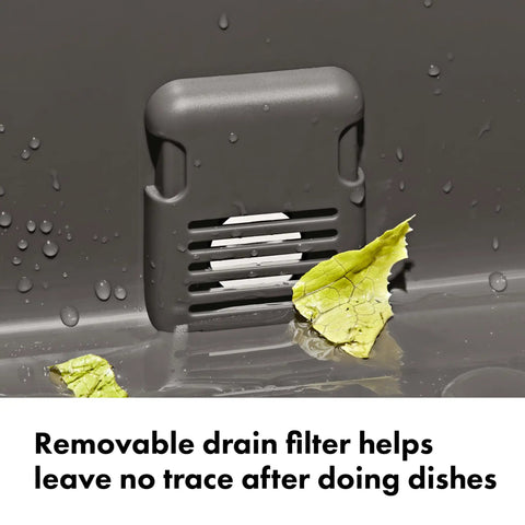 Outdoor Camp Kitchen Wash Dry And Stow System drain filter with leaf debris showing effective cleaning in gray bin