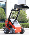 Compact Mini Skid Steer Loader with wide bucket, ideal for gardens, farms, and small jobs, 1800 lb capacity, parked outdoors