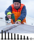 Man using a drill with Metric M4 Hex Socket Head Cap Screws Bolts Nuts And Washers Assortment Kit on a roof.