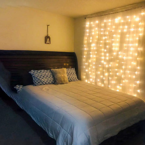 Bedroom with pink curtain lights eight modes with memory function for window decor six point six feet by six point six feet LED fairy string lights.