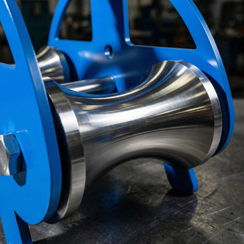 Close-up of Heavy Duty Cable Puller Sheave with stainless steel rollers on blue powder-coated steel frame, for rugged material handling.