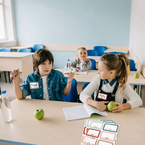 Children in classroom using Boho Rainbow Name Tag Stickers Pack Six Styles For Back To School And Classroom Decor Multipurpose Nametags.