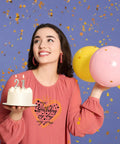 Woman holding birthday cake and balloons, wearing shirt with "Birthday Queen Iron On Transfer Kit With 4 Styles Washable Heat Transfers."