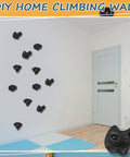 Indoor wall with 20 Rock Climbing Holds Set For DIY Wall Build With 3 Shapes Extra Large Grips, mounted against white background.
