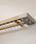 Premium Wall Mounted Sliding Barn Door Track System With 8.86ft Aluminum Alloy Rail And Faux Wood Finish showing smooth rollers and brackets.