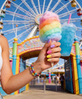 Hand with pastel nails holding cotton candy, showcasing Six Candy Colors Gel Nail Polish Set HEMA Free TPO Free Soak Off Gel Polish Kit 15ml
