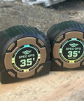 Kickin Tough 35 Foot Tape Measure Featuring Double Sided Blades And Grippy Magnetic Hook Military Hardened Composite Shell, two units side by side.