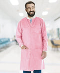 Man wearing Pink Disposable Lab Coat 2XL Unisex SMS 45GSM Breathable With Snap Front And Knit Collar Cuffs 3 Pockets