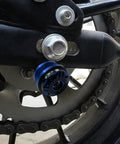 Close-up of GSX 8R CNC Aluminum Swingarm Spool Slider Kit Orange Anodized Pro Grade Motorcycle Accessory mounted on swingarm
