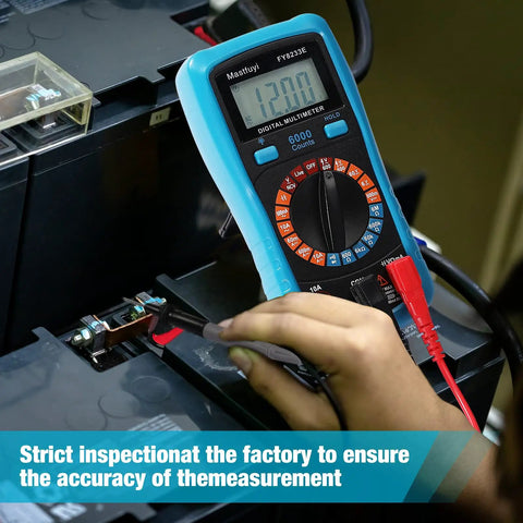 Person using digital multimeter to measure voltage on a battery.