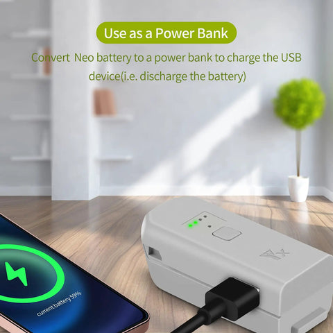 Neo Drone Battery Charger Hub Fast Charge Station with cable converting battery to USB power bank next to charging phone