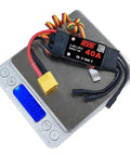 40A Beefed Up Brushless ESC For RC Fixed Wing Aircraft And Helicopter With 5V 4A SBEC XT60 on digital scale displaying 30.83g