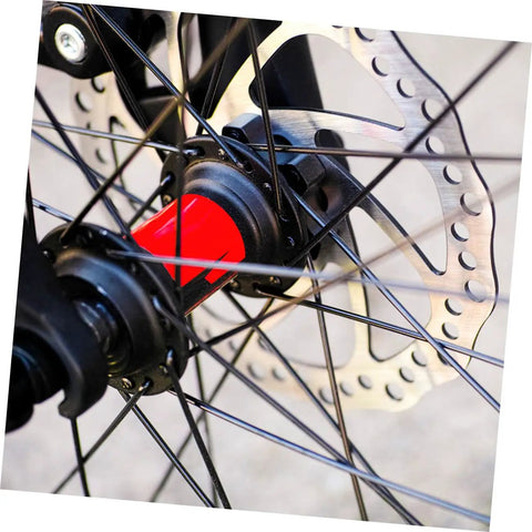 Close-up of Rock Solid Mountain Bike Disc Brake Kit with mechanical calipers, 160mm rotor mounted on wheel hub.