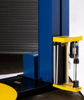 Heavy Duty Semi Auto Pallet Wrapper With Built In Digital Scale showing yellow and blue machine side and roller system