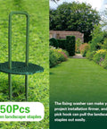 Green Painted Turf Stakes Set With 50 Stakes And 50 Buffer Washers 6 Inch 11 Gauge Heavy Duty Lawn Spikes For Grass Weed Barrier And Sod Fabric Rustproof Green Coated Ground Pins Reusable And Easy To Install shown with garden installation view