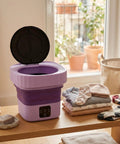 Slick Mini Folding Washing Machine 6 Liter Portable Unit Designed For College Dorms And Tiny Apartments with laundry nearby.